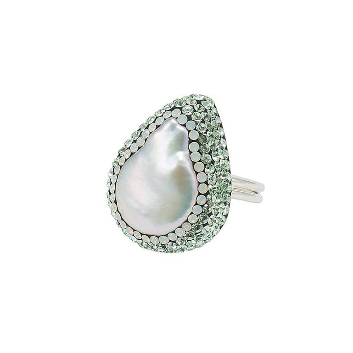 Soru Silver Baroque Pearl Ring Rhodium plated sterling silver ring featuring a natural white iridescent baroque pearl gemstone set within opal and pale green Swarovski crystal. Slight natural variances may occur between colours, shapes and sizes of the gemstones. Baroque pearls have an organic shape with an uneven surface. A Note On Pearl: June's birthstone, said to symbolize a pure heart and mind, innocence and faith. With links to the moon and water, helping to balance emotions. Length of stone: 3cm approx Size: adjustable band.